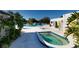 Community pool area with a hot tub, surrounded by lounge chairs and landscaping, offering a relaxing oasis at 8555 112Th St # 209, Seminole, FL 33772