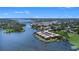 Panoramic aerial view of waterfront condos showcasing canal access, boat docks, and serene lake views at 10216 Seminole Island Dr, Largo, FL 33773
