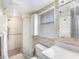 Updated bathroom featuring a glass-enclosed shower and modern fixtures at 10216 Seminole Island Dr, Largo, FL 33773