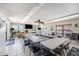 Spacious common room with large tables, TV, and plenty of room for activities with a view of the outdoors at 10216 Seminole Island Dr, Largo, FL 33773