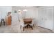 Dining room features a wood table with seating for four and access to the kitchen at 10216 Seminole Island Dr, Largo, FL 33773