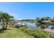 Picturesque waterfront property with a private dock, perfect for boating and enjoying the serene lake views at 10216 Seminole Island Dr, Largo, FL 33773