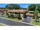 Two-story condo featuring a tile roof, screened-in patio, and attached garage at 10216 Seminole Island Dr, Largo, FL 33773