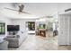 Bright living room features tile flooring, fireplace, and outdoor access at 10216 Seminole Island Dr, Largo, FL 33773