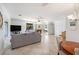 Inviting living room with tile floors, fireplace, and access to outdoor space at 10216 Seminole Island Dr, Largo, FL 33773