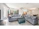 Spacious living room with tile floors and comfortable seating at 10216 Seminole Island Dr, Largo, FL 33773