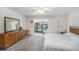 Main bedroom features a large window overlooking a peaceful water view at 10216 Seminole Island Dr, Largo, FL 33773
