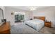Main bedroom features a large window overlooking a lake view at 10216 Seminole Island Dr, Largo, FL 33773