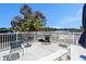 Enjoy outdoor grilling and relaxation on this patio with a white fence and a serene view of the water at 10216 Seminole Island Dr, Largo, FL 33773