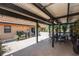Inviting covered patio with outdoor dining set and lush landscaping at 10216 Seminole Island Dr, Largo, FL 33773