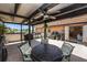 Cozy covered patio with dining set, perfect for entertaining outdoors at 10216 Seminole Island Dr, Largo, FL 33773