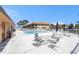 Relaxing pool area with lounge chairs, tables, and shade, perfect for enjoying the Florida weather at 10216 Seminole Island Dr, Largo, FL 33773