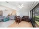 Bright sunroom connecting to the living room, with peaceful views at 10216 Seminole Island Dr, Largo, FL 33773