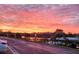 Stunning waterfront view at sunset, showcasing waterfront living with colorful skies and lush trees at 10216 Seminole Island Dr, Largo, FL 33773