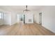 Open dining area featuring light wood floors and a stylish chandelier fixture at 104 W South Ave, Tampa, FL 33603