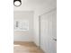 Clean, well-lit empty room with light wood flooring and a window at 104 W South Ave, Tampa, FL 33603