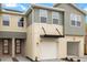 Stylish two-story townhome with modern design elements, including an attached garage and well-maintained landscaping at 1143 Creek Valley Ct, Brandon, FL 33511