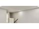Bright hallway featuring fresh paint, neutral carpet, and minimalist fixtures at 1143 Creek Valley Ct, Brandon, FL 33511