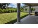 Spacious backyard with palm trees, perfect for relaxation or outdoor activities at 11884 Richmond Trl, Parrish, FL 34219