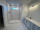Modern bathroom featuring a glass-enclosed shower with white marble-style tile and a vanity sink at 11884 Richmond Trl, Parrish, FL 34219