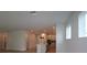 Open-concept kitchen and living space with island and recessed lighting creates an airy atmosphere at 11884 Richmond Trl, Parrish, FL 34219