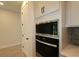 Close-up of the stainless steel microwave and oven in the kitchen at 11884 Richmond Trl, Parrish, FL 34219