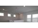 Bright upper-level hallway with natural lighting and recessed lighting at 11884 Richmond Trl, Parrish, FL 34219