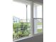 View from home's window overlooking green landscaping, street, and neighboring homes at 11884 Richmond Trl, Parrish, FL 34219