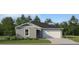 Charming single-story home with a two-car garage and professionally landscaped front yard at 11917 Brae Way, Dade City, FL 33525