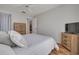 This cozy bedroom offers natural light and includes wood-look floors and neutral wall colors at 1201 Montrose Pl, Dunedin, FL 34698