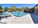 A refreshing community pool surrounded by lounge chairs and lush greenery, perfect for relaxation and recreation at 1201 Montrose Pl, Dunedin, FL 34698