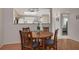 Cozy dining area features a wood table with seating and overlooks the kitchen at 1201 Montrose Pl, Dunedin, FL 34698