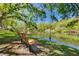 Relax on the bench and enjoy the beautiful view of the lake at 1201 Montrose Pl, Dunedin, FL 34698