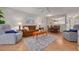 A welcoming living room with comfortable seating, stylish decor and a view to the kitchen at 1201 Montrose Pl, Dunedin, FL 34698
