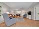 Bright living room with plenty of seating, neutral paint and an open concept to the kitchen at 1201 Montrose Pl, Dunedin, FL 34698