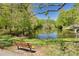 Beautiful pond with a serene setting and bench seating, providing a peaceful retreat within the community at 1201 Montrose Pl, Dunedin, FL 34698