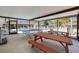 Covered poolside pavilion featuring picnic tables and a ping pong table, great for outdoor gatherings at 1201 Montrose Pl, Dunedin, FL 34698