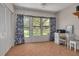 Bright sunroom featuring access to backyard, large windows with natural light and vinyl floors at 1201 Montrose Pl, Dunedin, FL 34698
