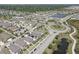 Overhead view featuring homes, a roundabout, and meticulous landscaping in a residential area at 12421 Triple Creek Blvd, Riverview, FL 33579