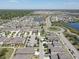 Aerial shot showcasing homes, landscaping, and a roundabout in a well-planned community at 12421 Triple Creek Blvd, Riverview, FL 33579