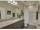 Bathroom showcasing granite countertop, vanity, and shower-tub combination with a decorative theme at 12421 Triple Creek Blvd, Riverview, FL 33579