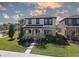 Charming two-story home with a well-manicured lawn and inviting front entrance at 12421 Triple Creek Blvd, Riverview, FL 33579