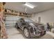 Attached two car garage with new car, shelving, and insulated garage door at 12421 Triple Creek Blvd, Riverview, FL 33579