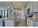 Modern kitchen with stainless steel appliances, granite countertops, and an open layout at 12421 Triple Creek Blvd, Riverview, FL 33579