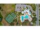 Aerial view of a community featuring tennis courts, a pool, and clubhouse at 12421 Triple Creek Blvd, Riverview, FL 33579