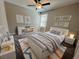 Comfortable bedroom featuring a window, bright neutral decor, and an accent rug at 12957 Wildflower Meadow Dr, Riverview, FL 33579