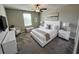 Cozy bedroom with a plush bed, white furnishings, and soft lighting, creating a comfortable and inviting atmosphere at 12957 Wildflower Meadow Dr, Riverview, FL 33579
