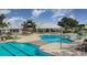 Beautiful community pool with lounge chairs and covered seating areas perfect for relaxing and socializing at 12957 Wildflower Meadow Dr, Riverview, FL 33579