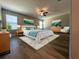 Relaxing main bedroom suite with stylish furnishings, including a king-size bed and coordinating decor, creating a serene retreat at 12957 Wildflower Meadow Dr, Riverview, FL 33579