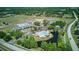 An aerial shot highlights the community's outdoor amenities: a pool, baseball field, and tennis and basketball courts at 13122 Prestwick Dr, Riverview, FL 33579